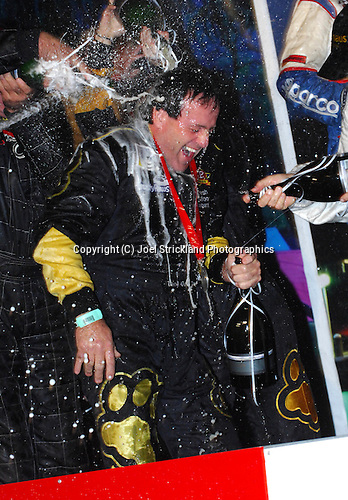 Tony Quinn cops the Champagne after the podium presentation