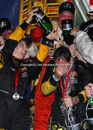 Tony Quinn cops the Champagne after the podium presentation