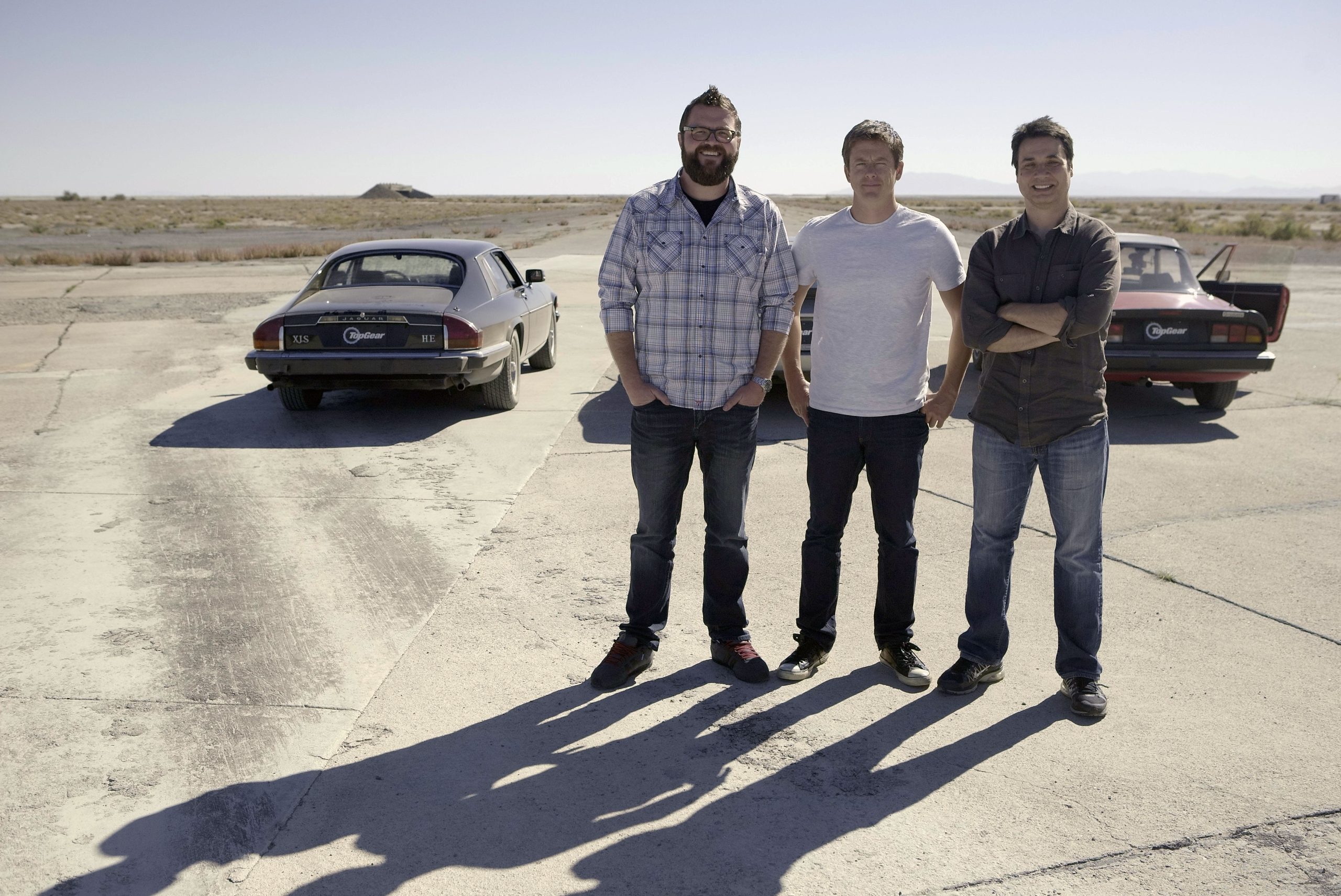 Picture Shows: Rutledge Wood, Tanner Foust, and Adam Ferrara stand up with 1984 Jaguar XJ-S V12, 1985 Porsche 944, 1989 Alpha Romeo Spider parked behind